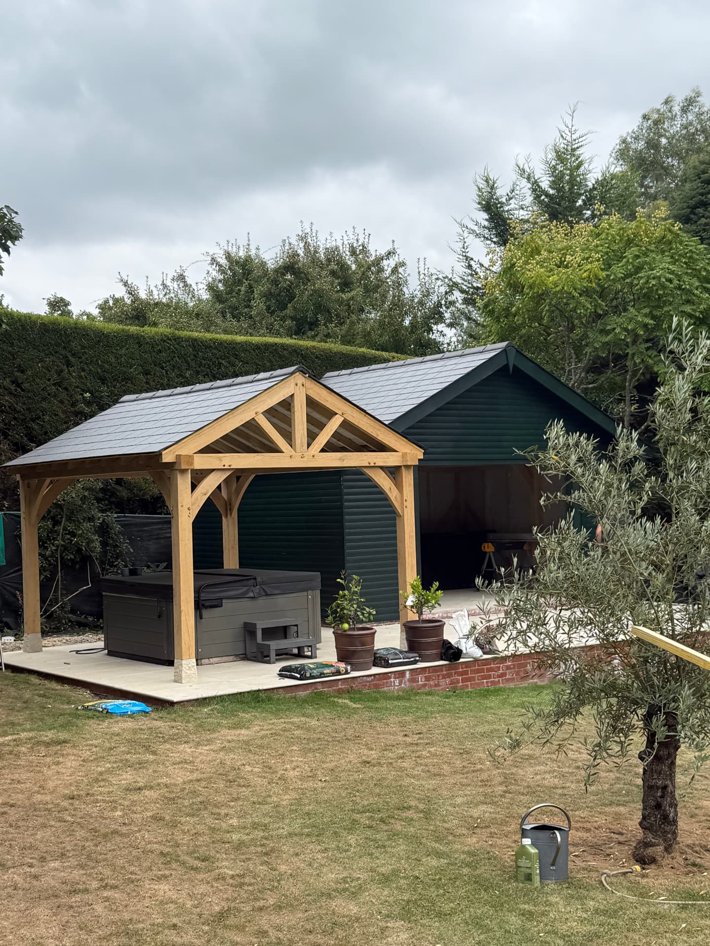 Slate roof on a garden outbuilding with oak porch